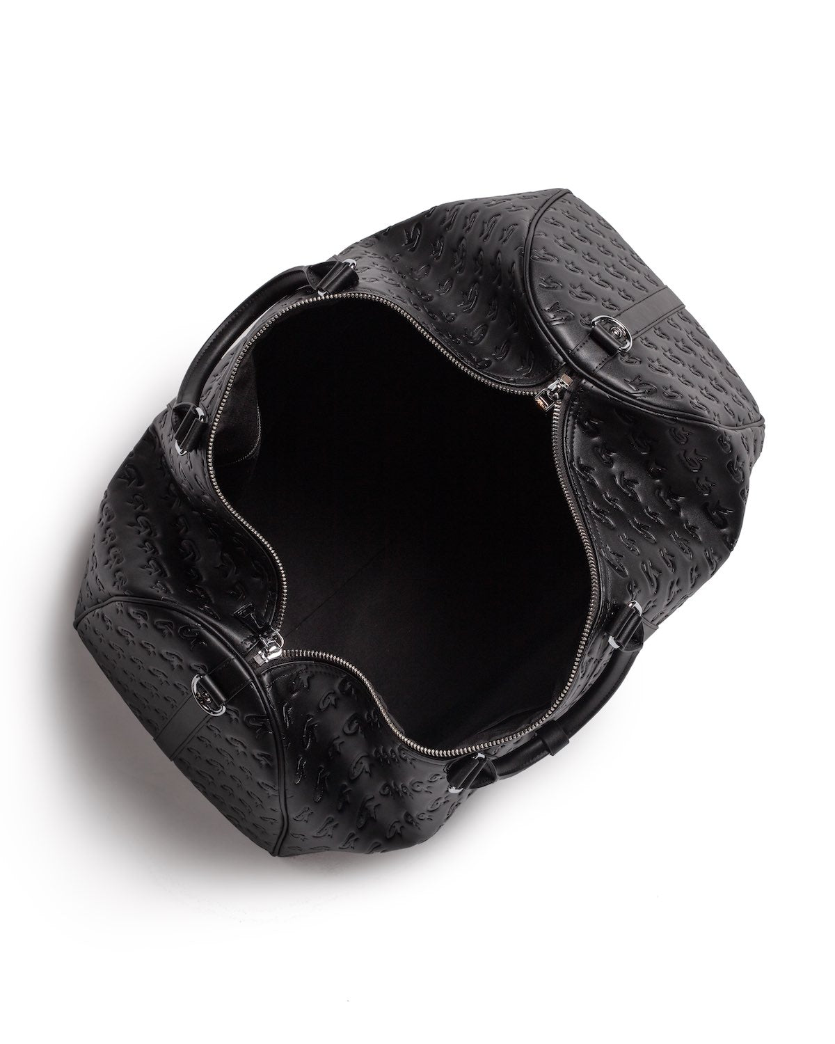 Open black monogram unisex duffle bag with embossed logo pattern, silver zipper, and sturdy handles, empty inside.