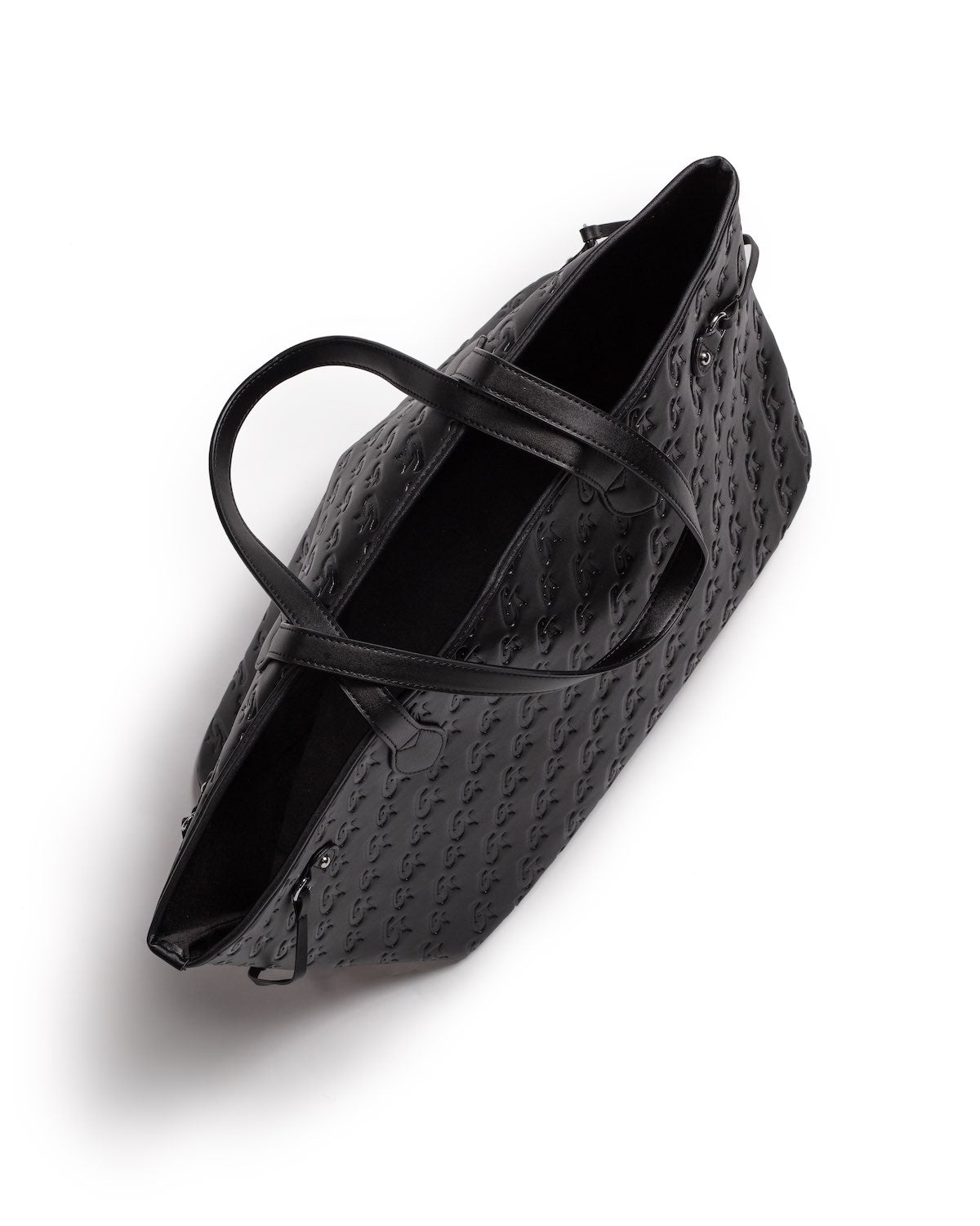 Black Monogram Glam Tote bag with embossed logo pattern, dual top handles, and spacious interior.