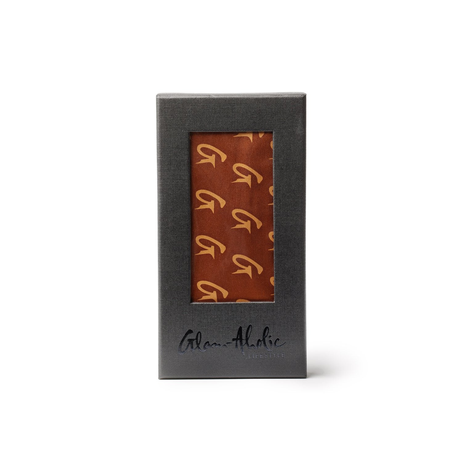 Brown silk scarf with large monogram pattern, packaged in a black box with a window display.