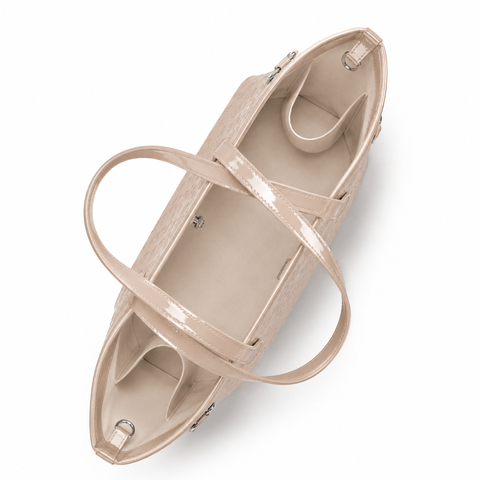 Spacious nude travel bag with interior compartments and stylish handles, perfect for organized travel.