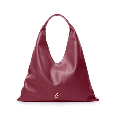 Burgundy pebble hobo shoulder bag with a slouchy design and a gold logo accent, perfect for stylish everyday use.