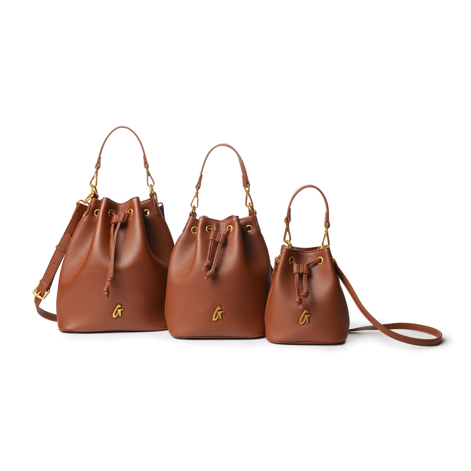 Set of three medium-sized brown pebble bucket bags with gold hardware, drawstring closure, and adjustable straps.