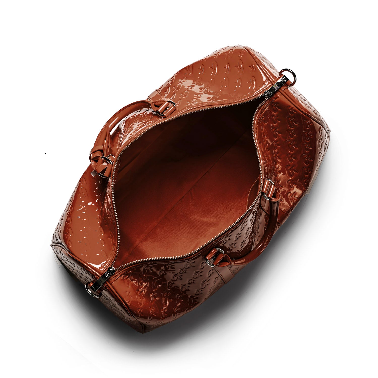 Spacious mirror brown monogram travel set bag with a glossy finish and zippered opening, perfect for stylish getaways.