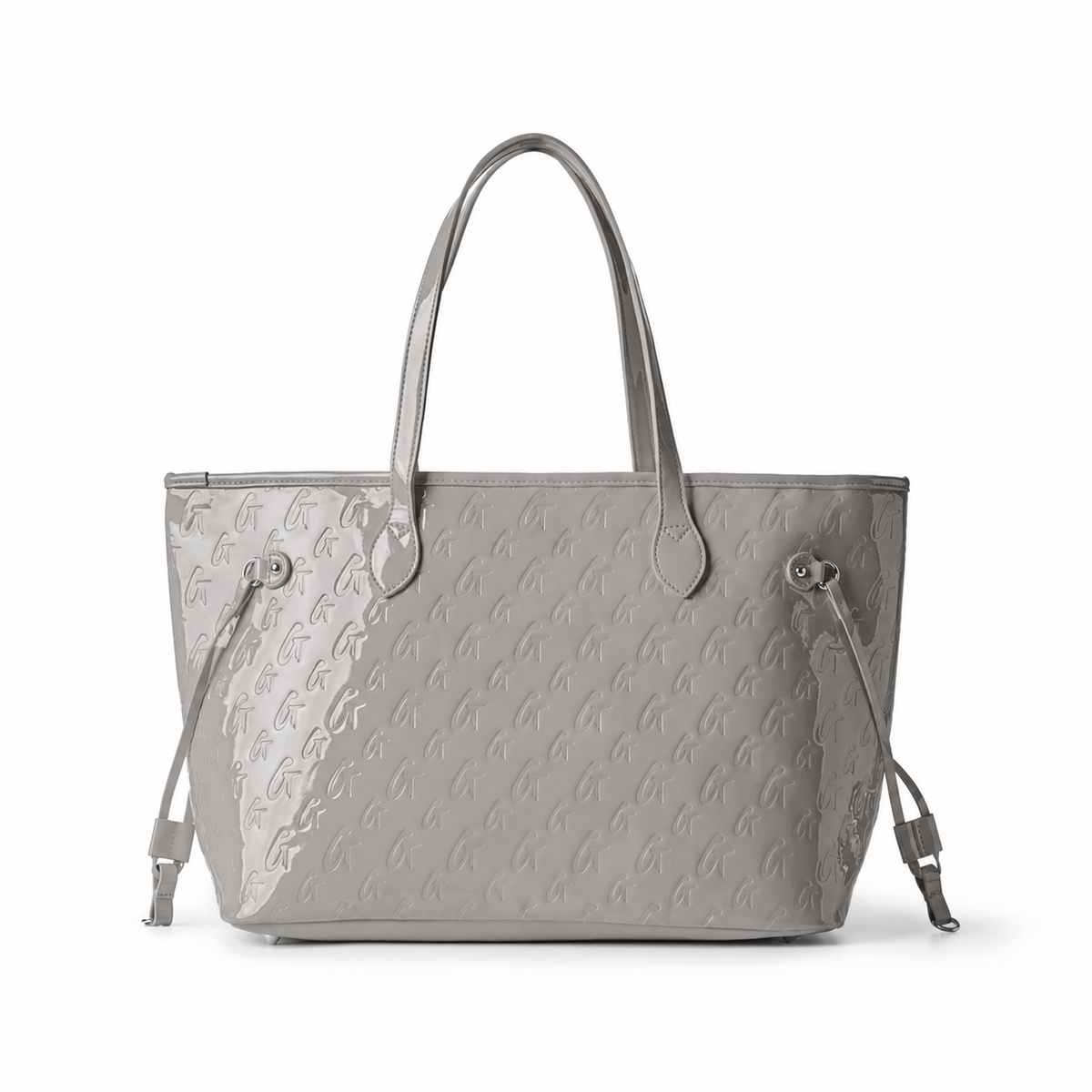 Stylish mirror gray monogram tote bag with wristlet, featuring a spacious design and elegant embossed logo.