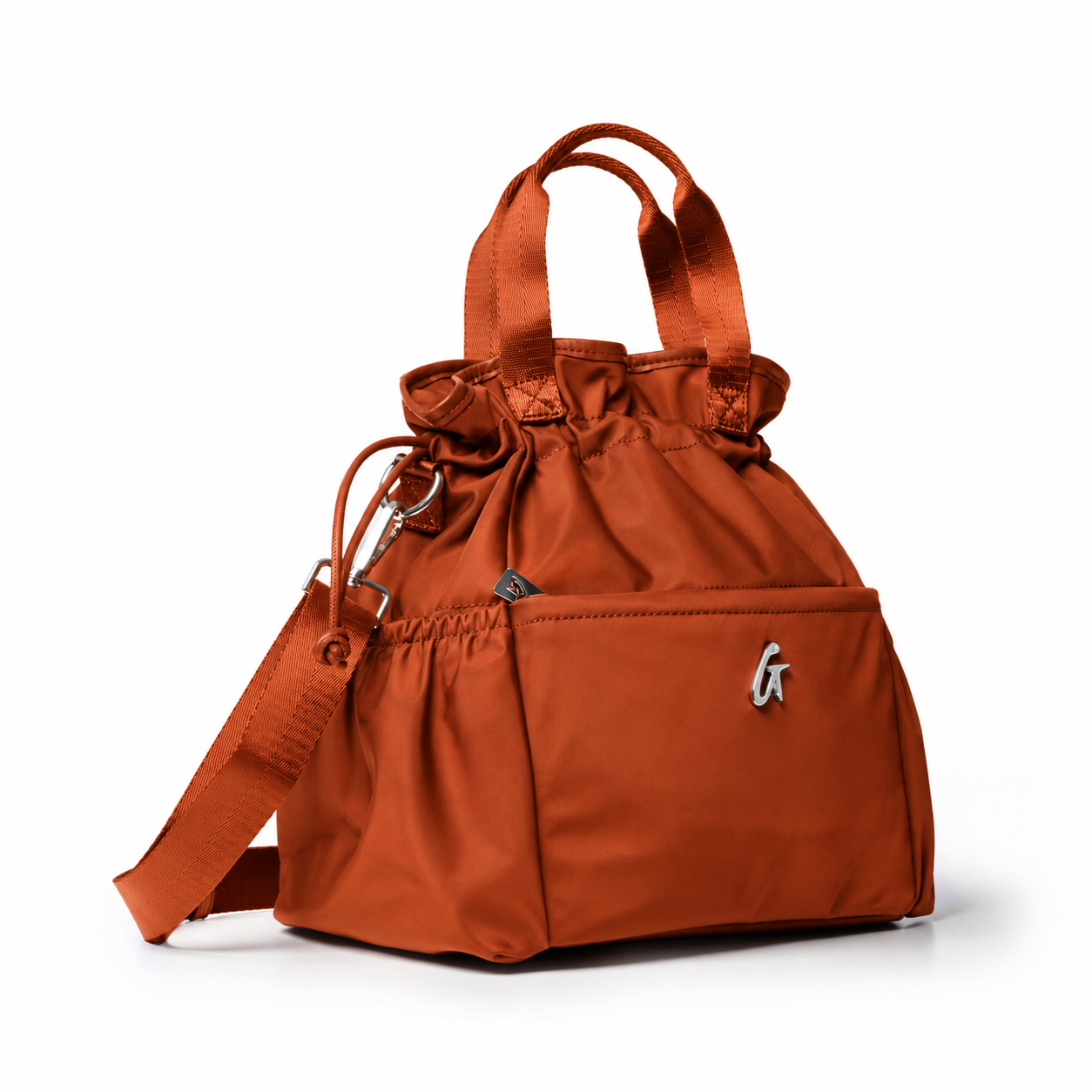 Brown nylon lunch bag with a cinched top, dual handles, and a detachable shoulder strap for stylish convenience.