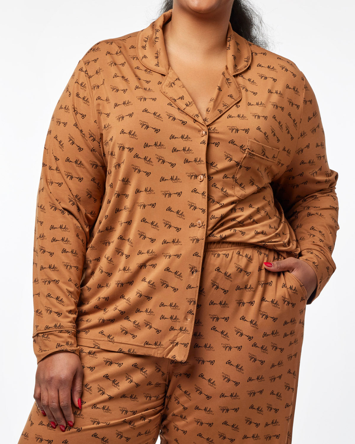 Brown long pajamas featuring a stylish signature print, designed for comfort and a chic loungewear look.