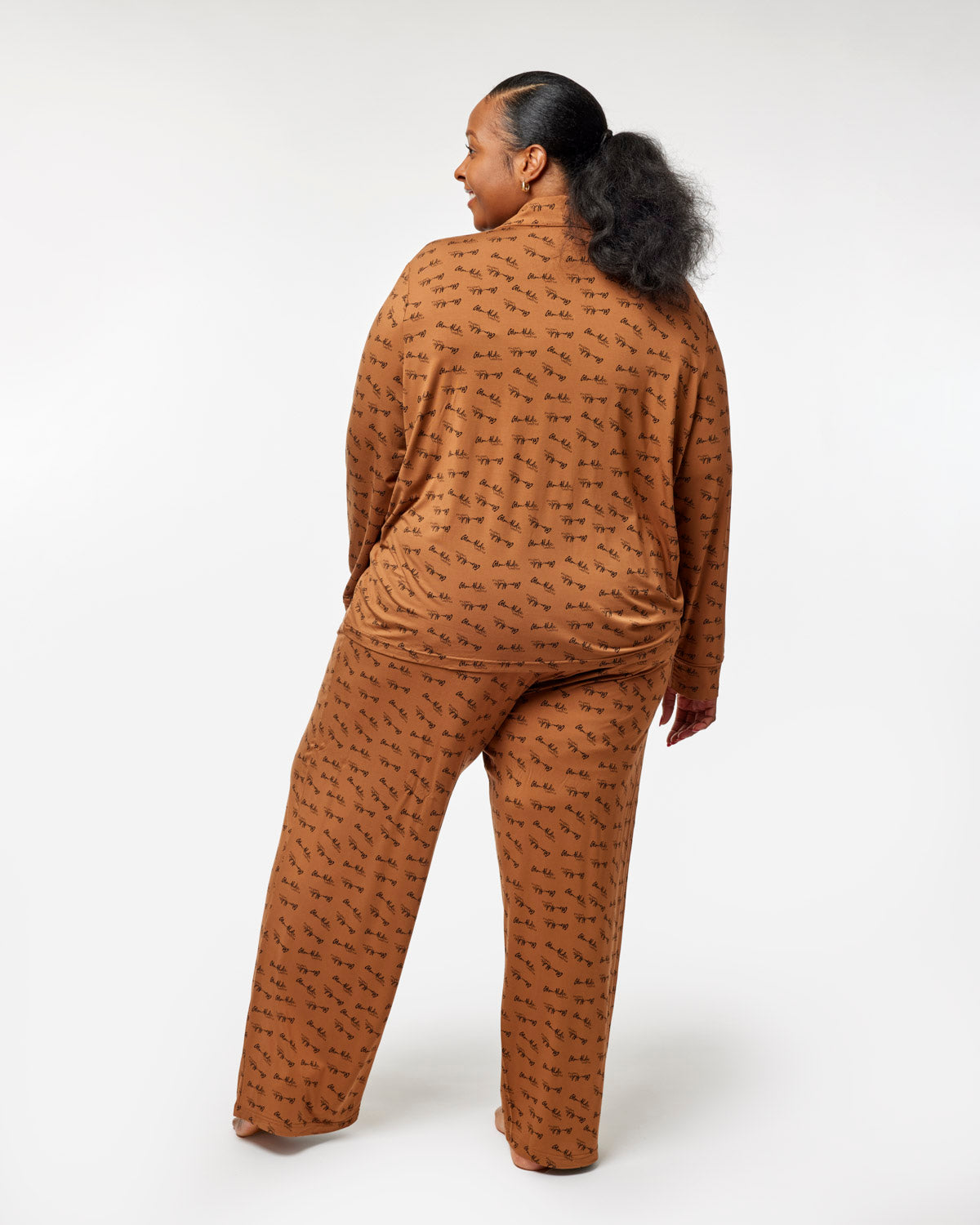 Cozy brown long pajamas featuring a stylish print, perfect for comfortable lounging at home.
