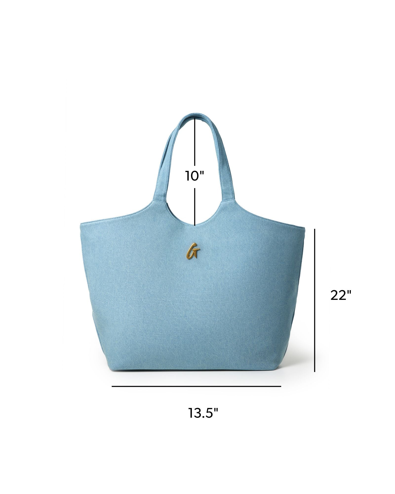 Light blue denim maxi tote bag with gold logo, measuring 22 inches wide and 10 inches tall, perfect for stylish everyday use.