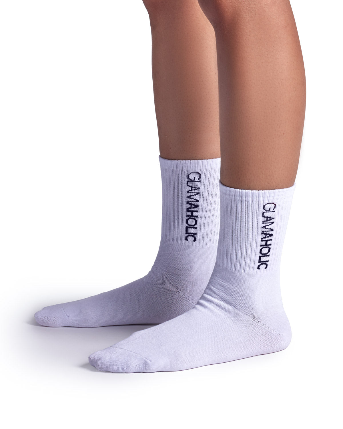 White athletic crew socks featuring a ribbed design and the "Glam-Aholic" logo on the cuff, ideal for sports and casual wear.
