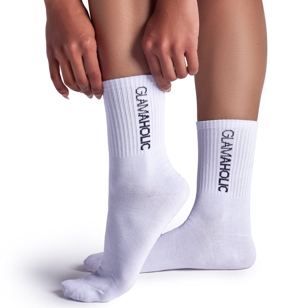 Black athletic crew socks with a ribbed design and "Glam-Aholic" logo displayed prominently on the side.