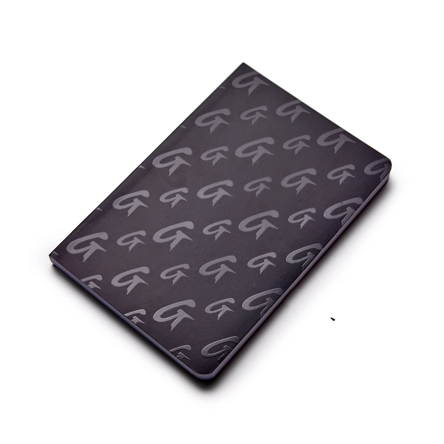 Black monogram notebook with a repeating G logo pattern on the cover.