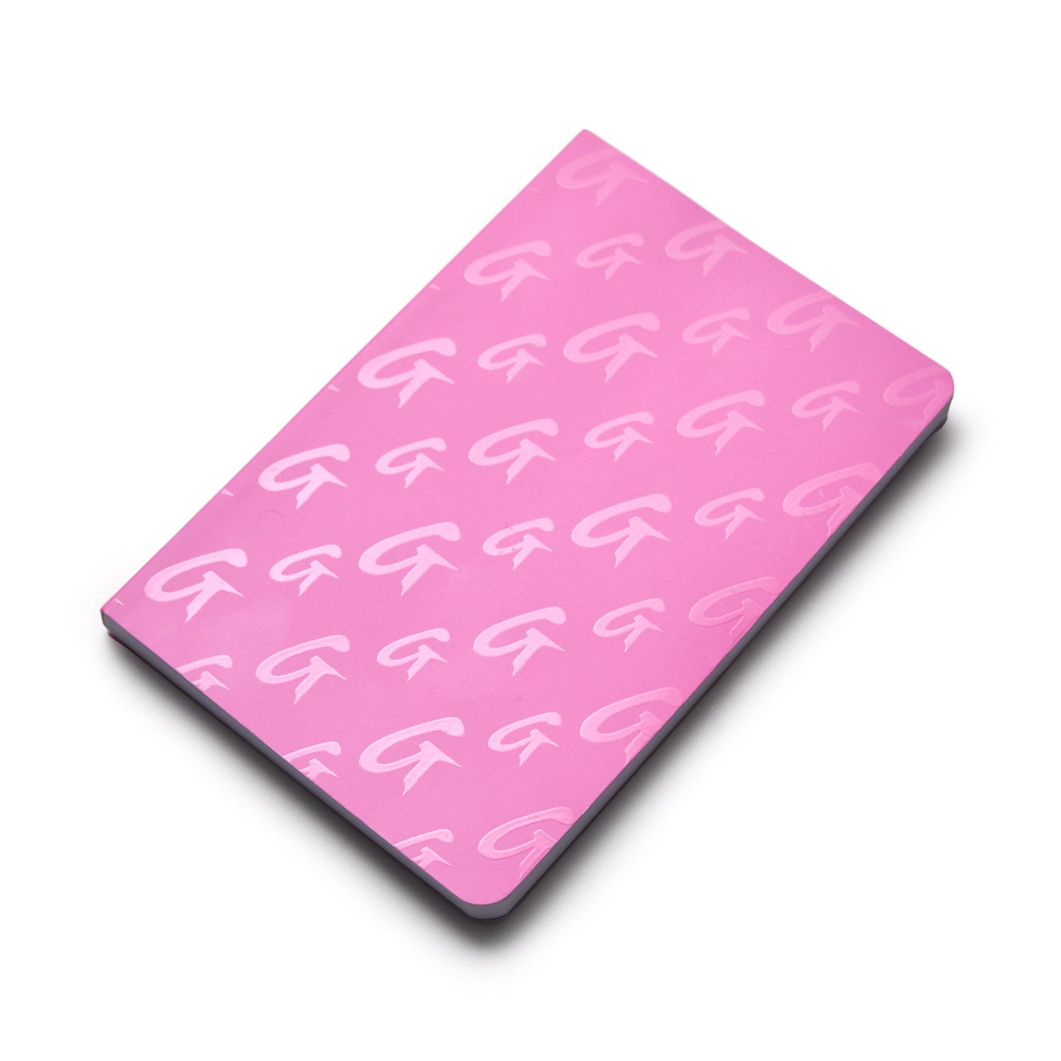 Hot pink monogram notebook with a repeating "G" pattern on the cover.