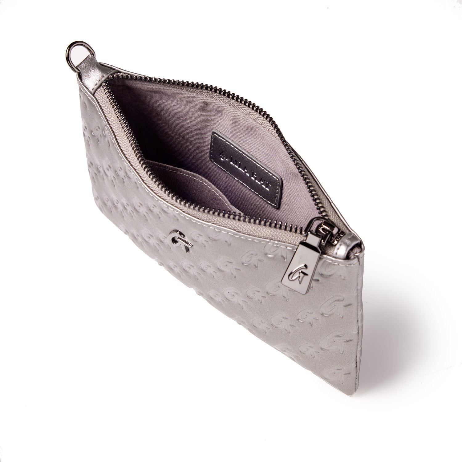 Mini Monogram Gunmetal Wristlet in platinum with embossed logo, zip closure, and interior card pocket.