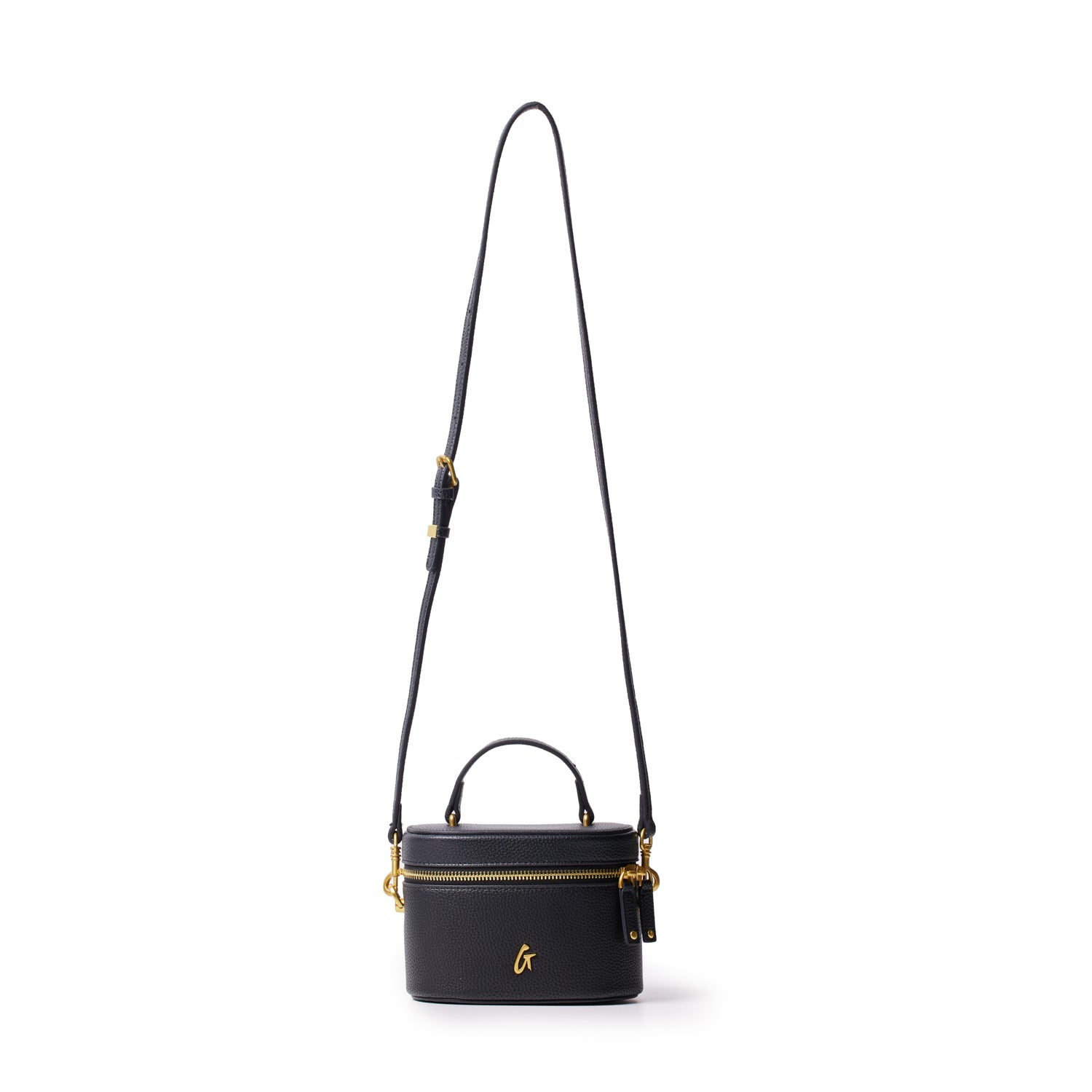 Small black pebble vanity bag with gold hardware, a top handle, and a detachable shoulder strap.