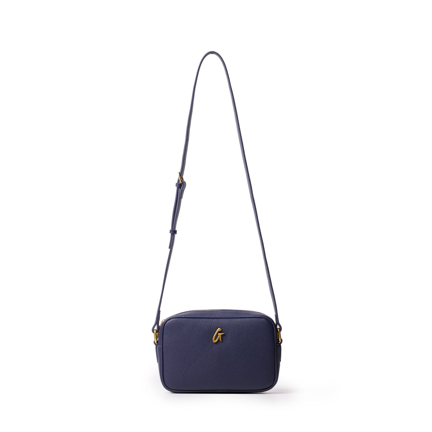 Navy leather camera bag with a gold "G" logo, adjustable strap, and compact rectangular design.