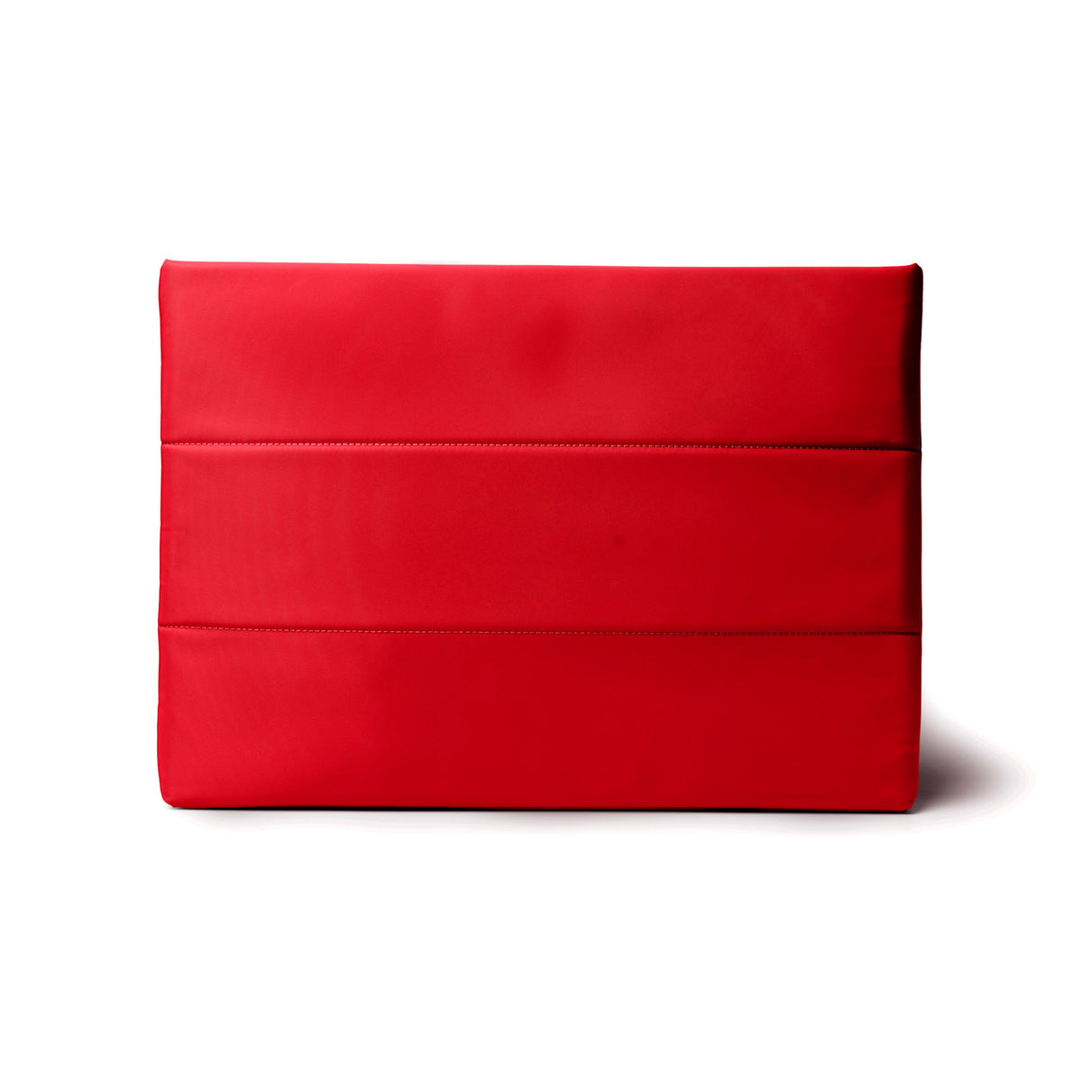 Red nylon laptop sleeve featuring a sleek design and padded protection for devices. Ideal for stylish, on-the-go professionals.