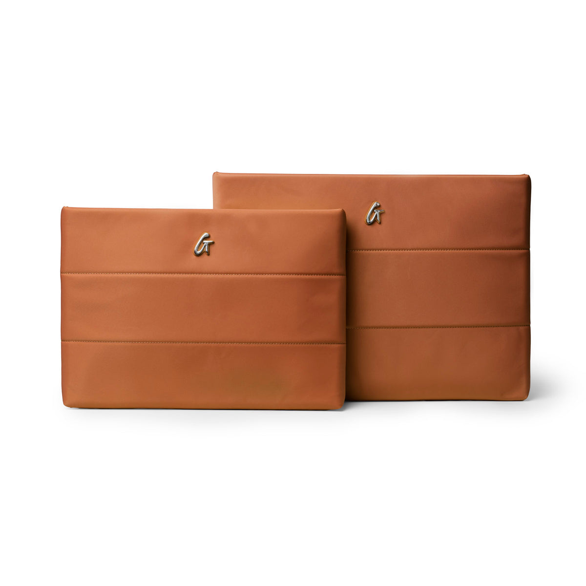 Brown nylon laptop sleeves in two sizes, featuring a sleek design and embossed logo for stylish protection.