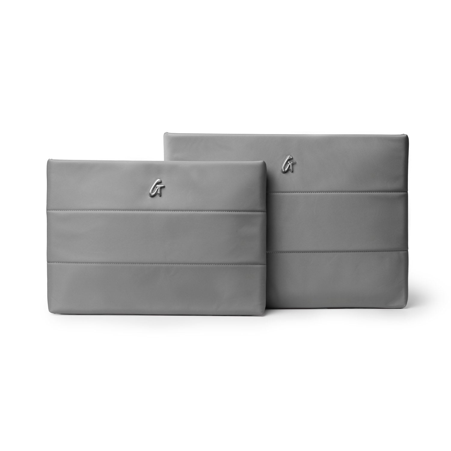 Gray nylon laptop sleeve set featuring a sleek design and subtle logo, perfect for stylish protection of devices.