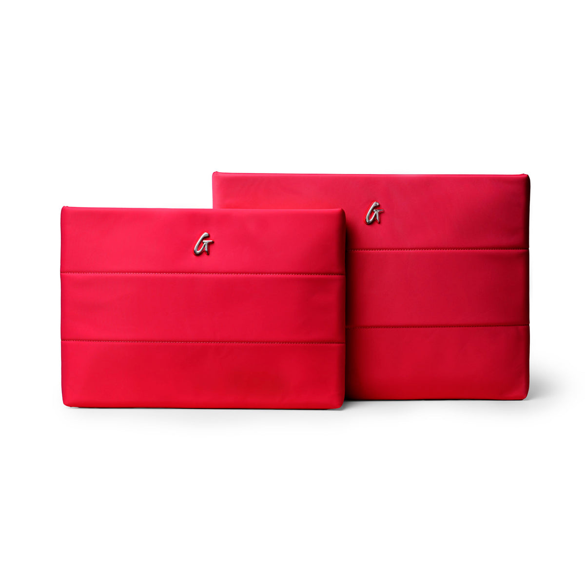 Red nylon laptop sleeves in two sizes, featuring a sleek design and embossed logo, ideal for stylish protection.