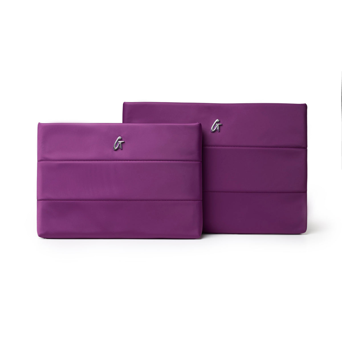 Purple nylon laptop sleeves in two sizes featuring a sleek design and a subtle logo, perfect for stylish protection.