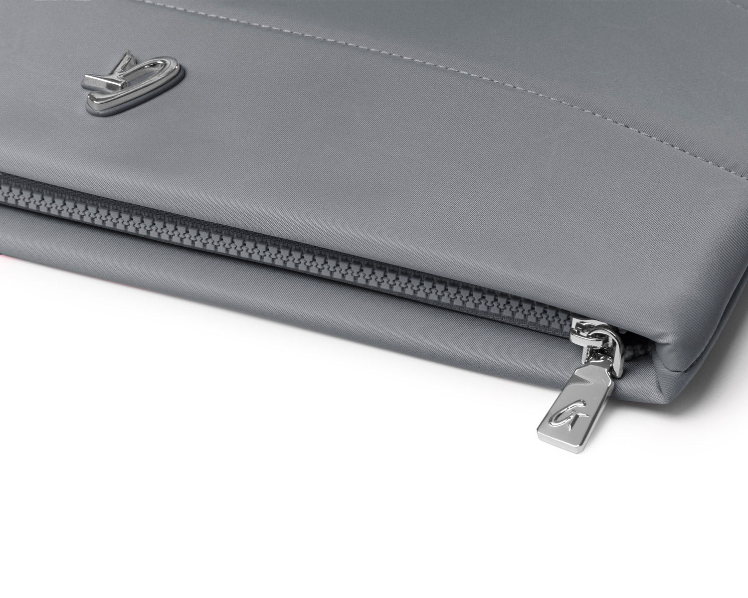 Gray nylon laptop sleeve featuring a sleek design and a zip closure for secure storage. Ideal for stylish protection.