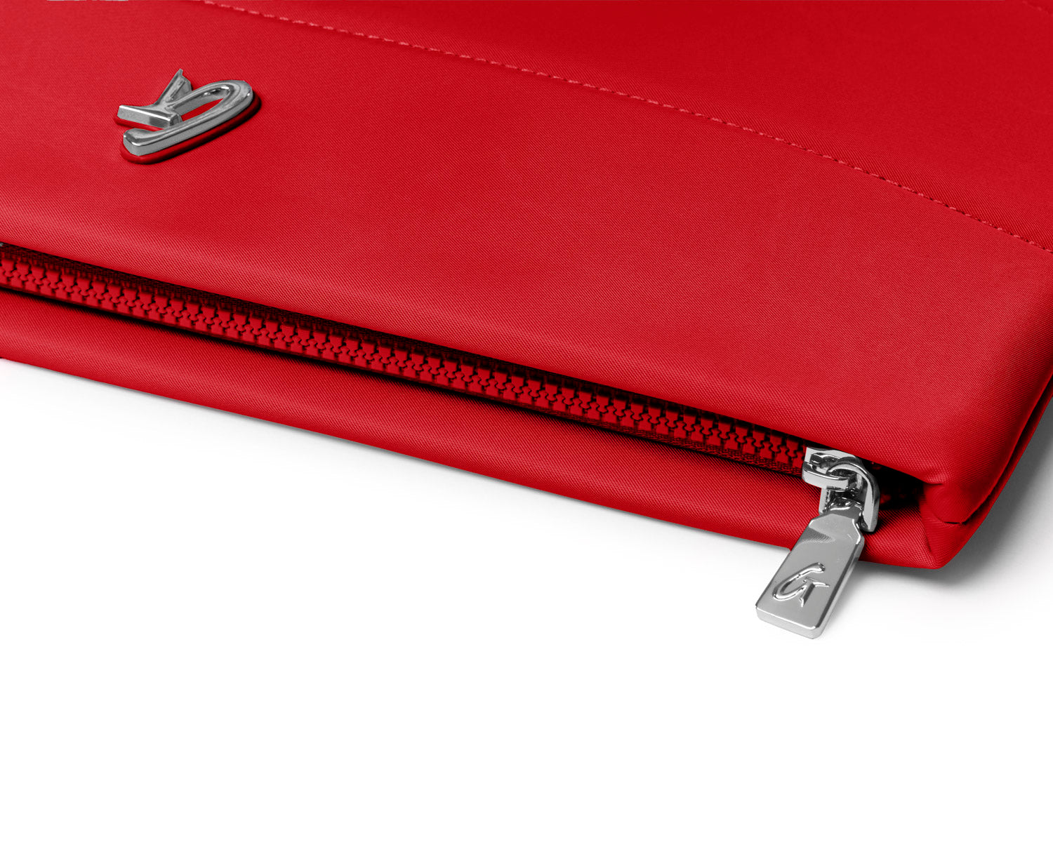 Red nylon laptop sleeve featuring a sleek design and a durable zipper closure for stylish protection.