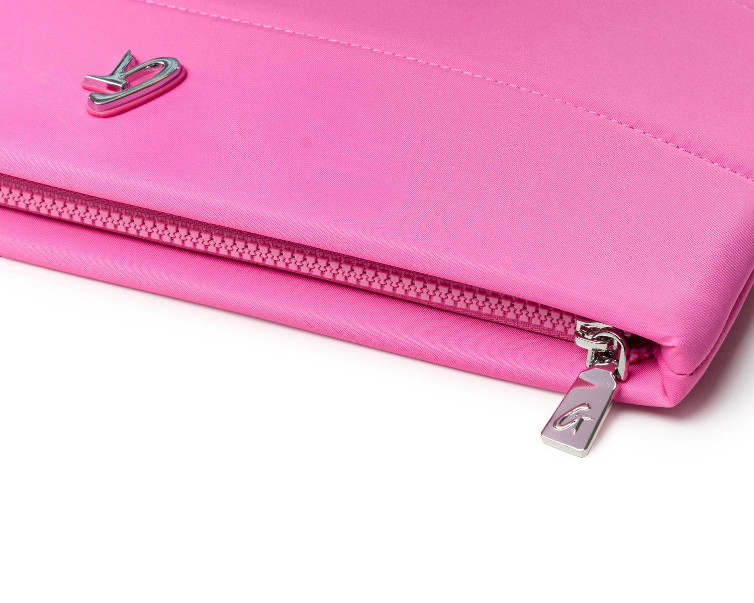 Hot pink nylon laptop sleeve with a sleek design and silver zipper, perfect for stylish protection of your device.