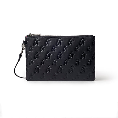Black monogram wristlet featuring embossed logo design, zip closure, and detachable wrist strap for stylish convenience.
