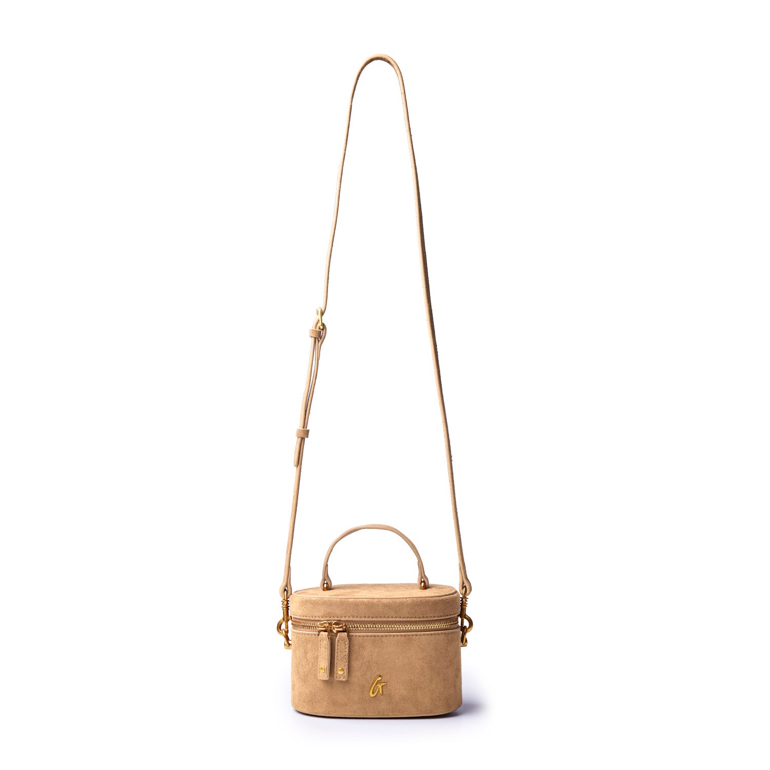 Tan mini suede vanity bag with a top handle and adjustable shoulder strap, perfect for stylish on-the-go storage.