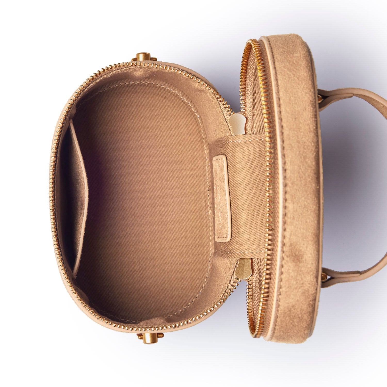 Tan mini suede vanity bag with a zip closure and spacious interior, perfect for organizing cosmetics and accessories.