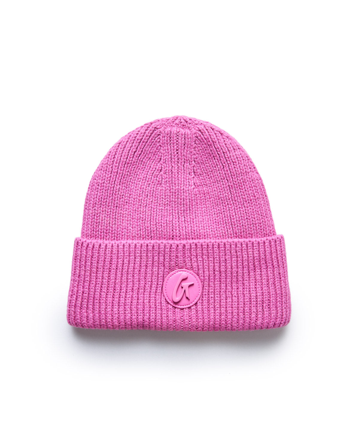 Pink knit beanie with a folded cuff and a circular logo patch featuring a stylized "G" on the front.