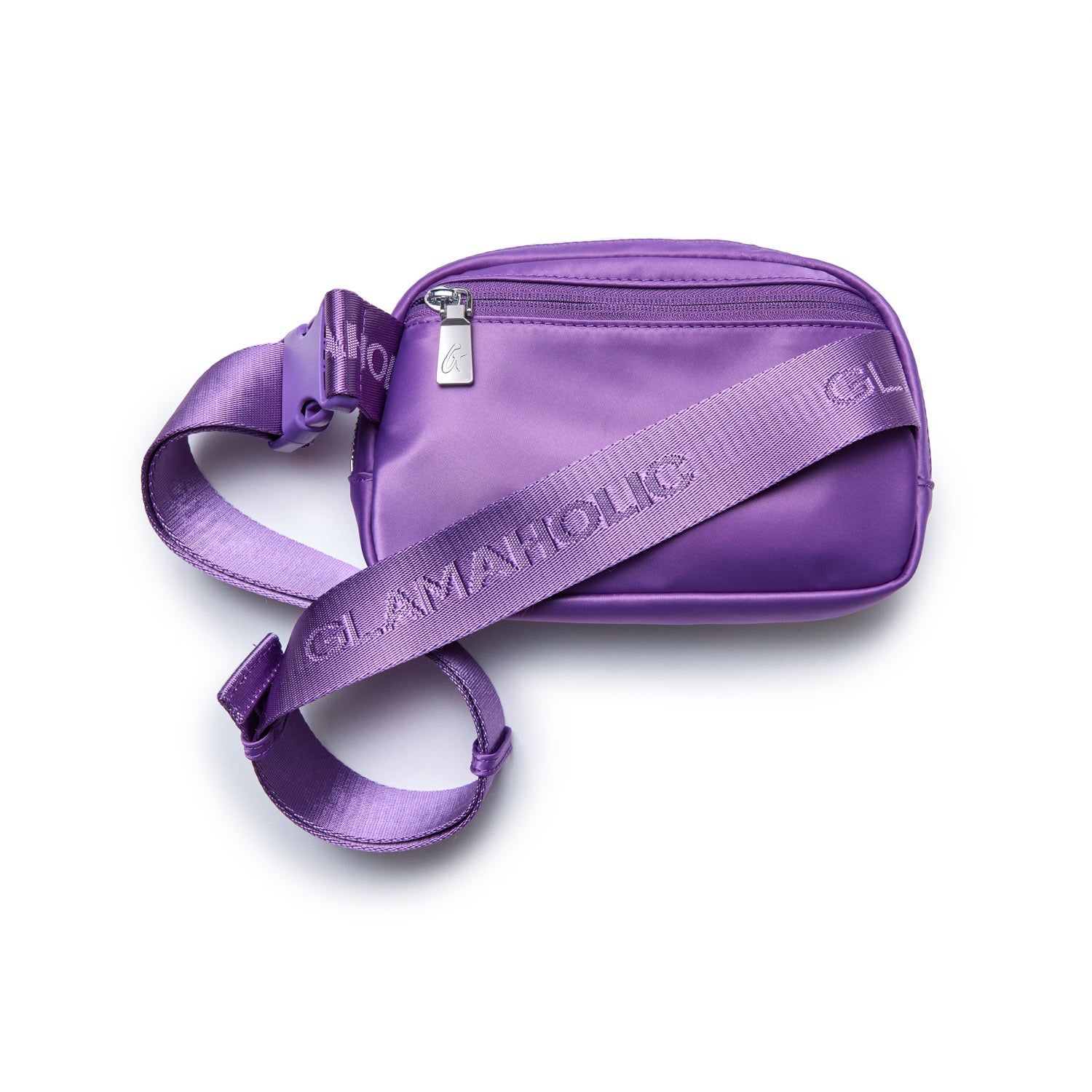 Purple nylon fanny pack with adjustable strap, front zip pocket, and "GLAMADHOLLIG" branding on the strap.