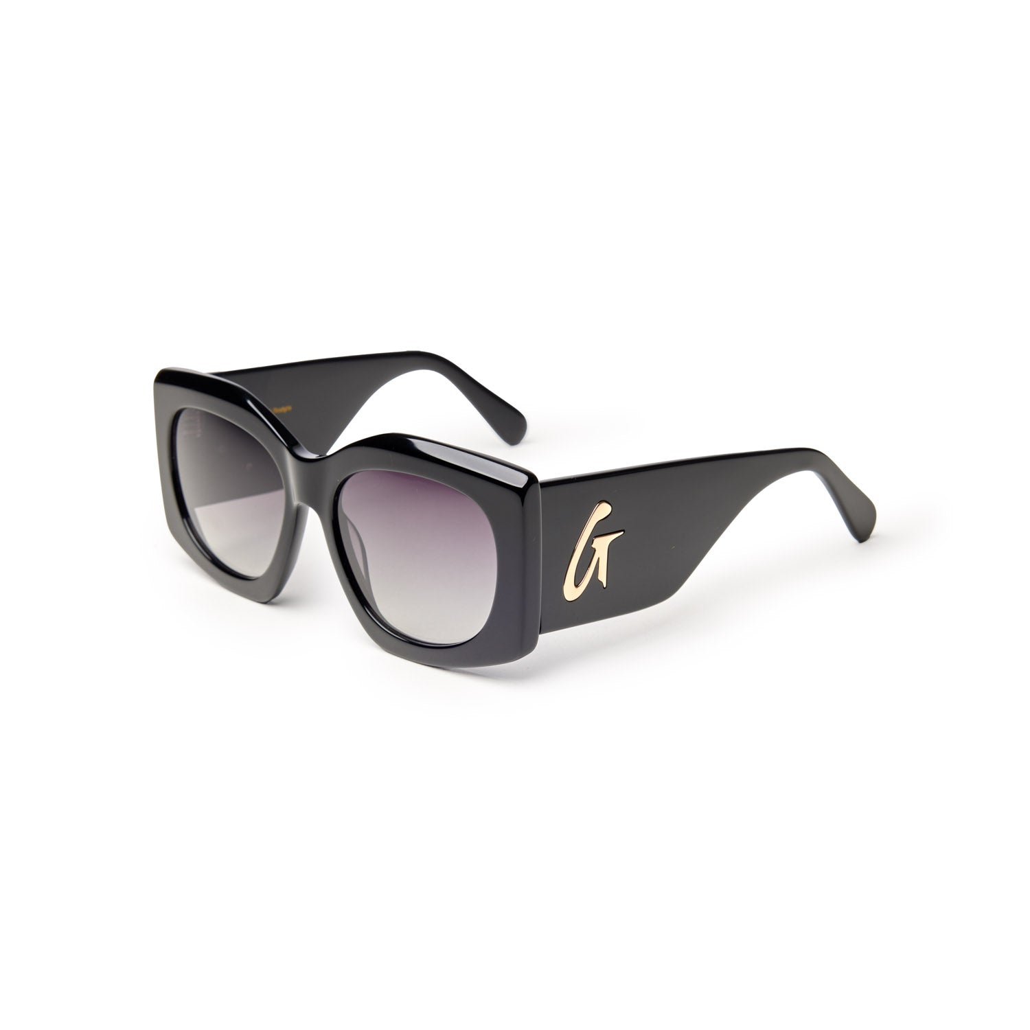 Oversized black sunglasses with gradient lenses and a gold logo on the side, offering a chic and stylish look.