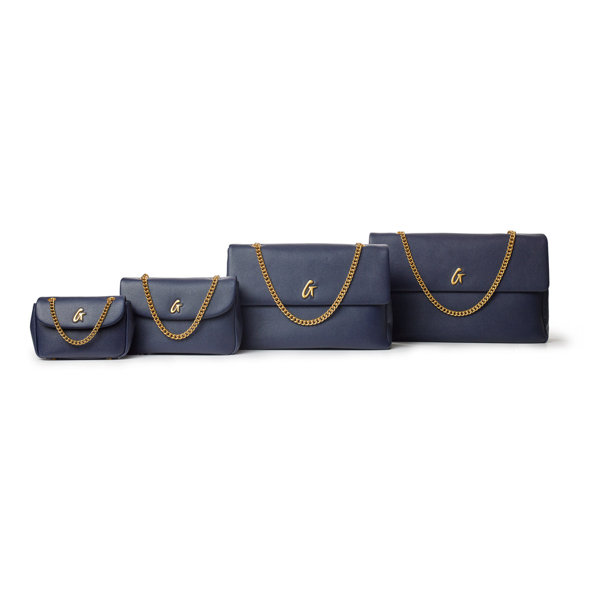 Set of four navy medium pebble flap bags with gold chain straps and a gold "G" logo on the front, arranged in size order.