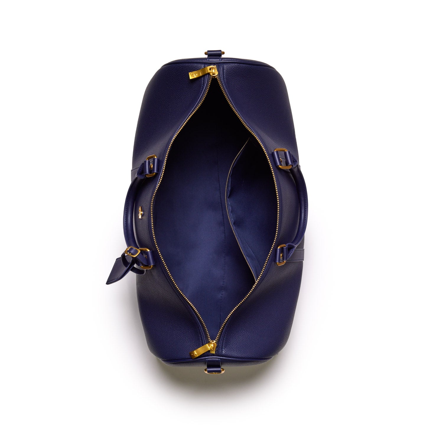 Open navy Pebble Duffle Bag with gold zipper and adjustable straps, showing spacious interior and side pockets.