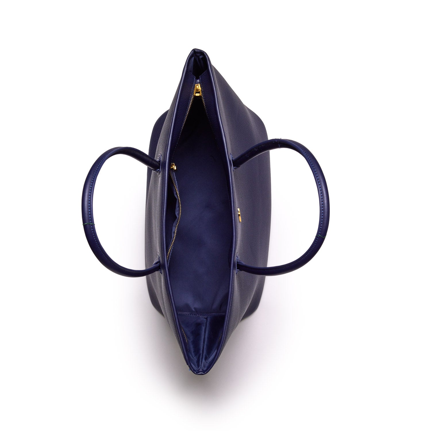 Open navy pebble tote bag with gold zipper details, showing spacious interior and sturdy double handles.