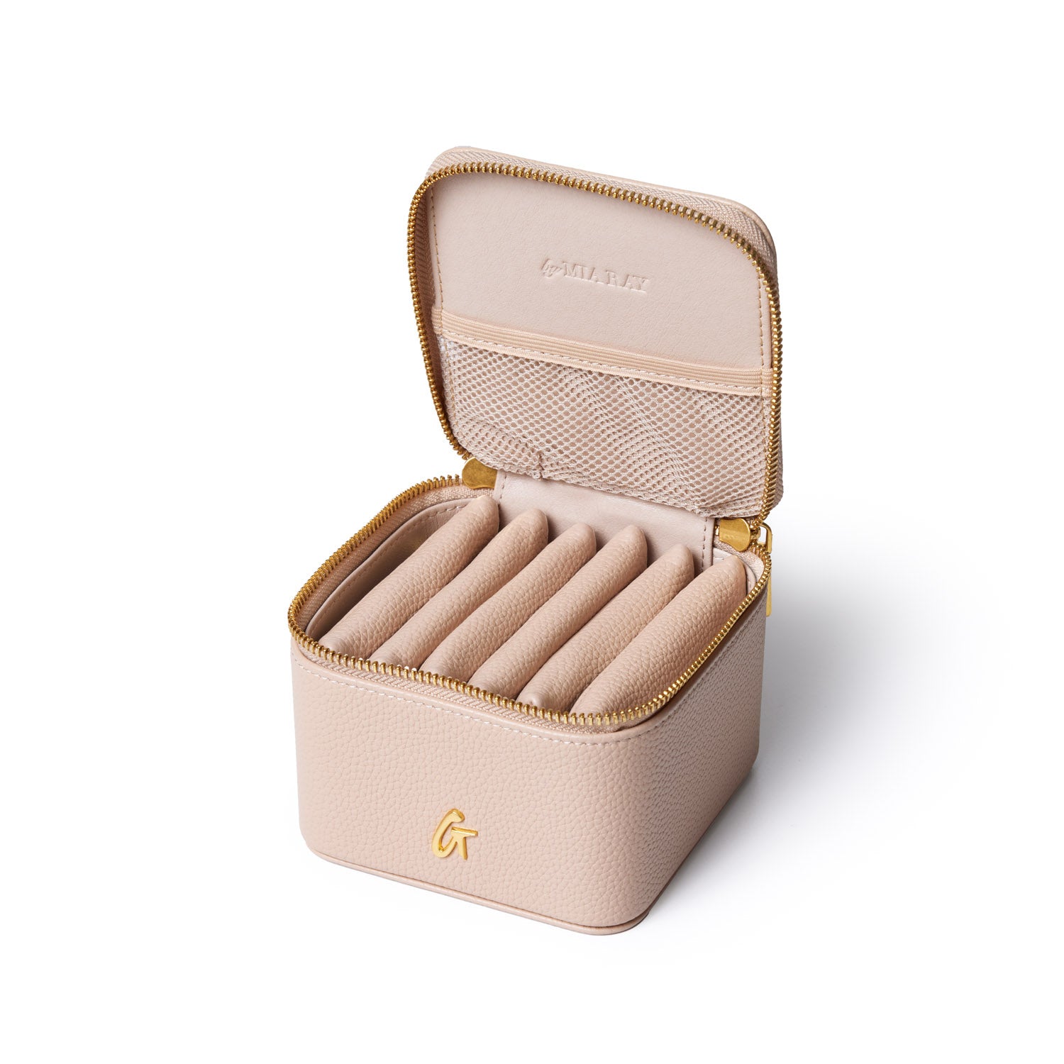Open pebble jewelry case in nude with gold zipper and interior compartments for rings and small jewelry pieces.