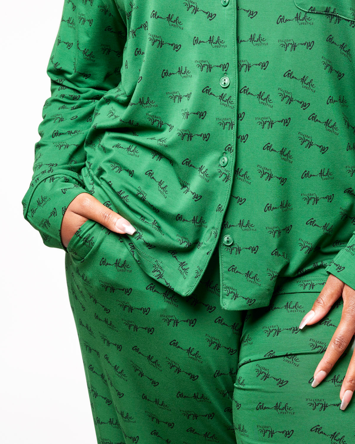 Green signature pajamas featuring a stylish all-over logo print, perfect for comfortable lounging at home.
