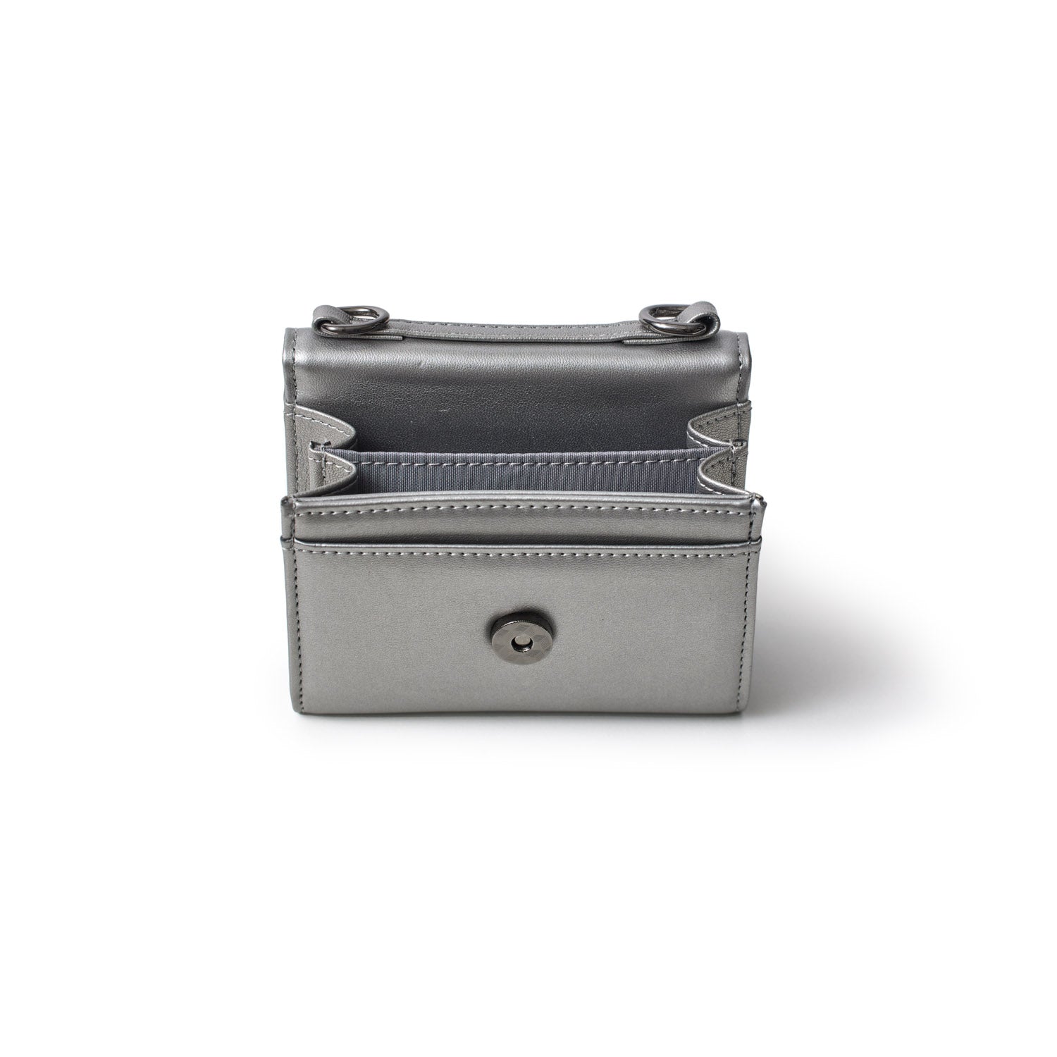 Small gunmetal gray compact wallet with multiple card slots and a snap button closure, designed for women on the go.