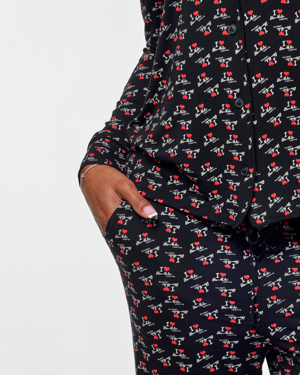 Cozy black pajamas featuring a playful "I Love Gal" print, perfect for stylish relaxation at home.