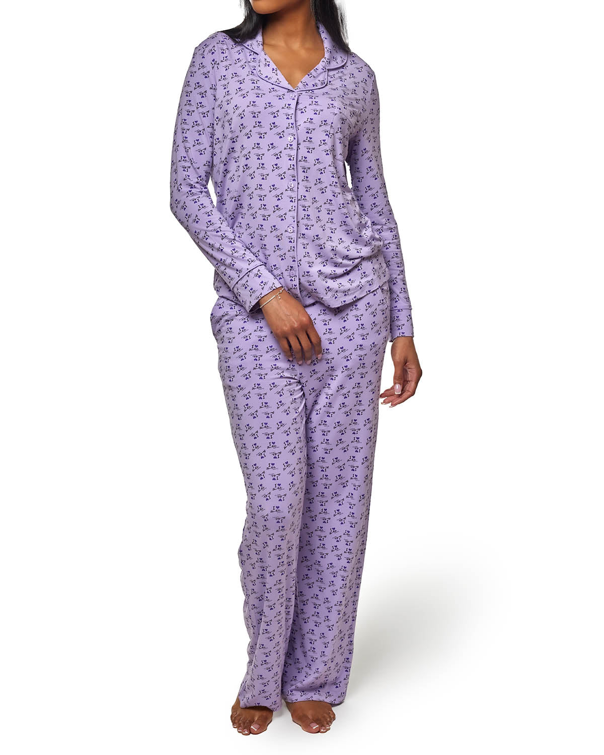 Purple long pajamas with a stylish print, featuring a button-up top and relaxed fit pants for comfortable lounging.