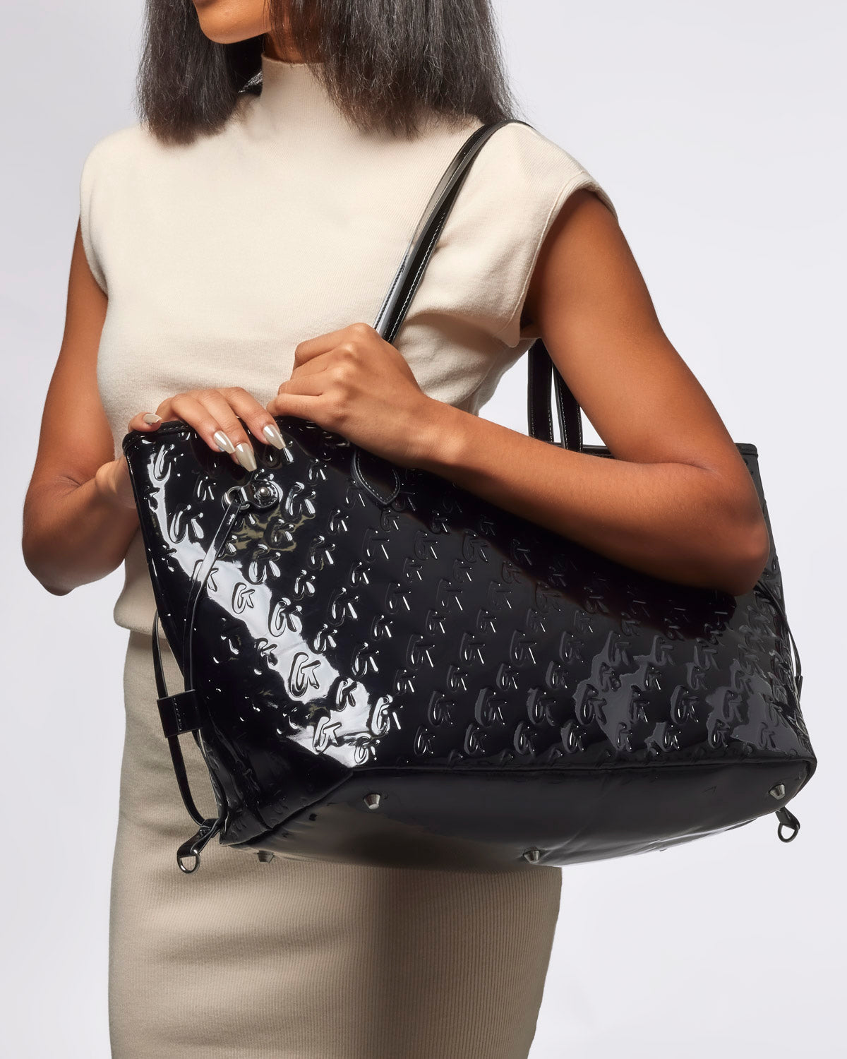 Sleek mirror black monogram glam tote with wristlet, showcasing a stylish design perfect for everyday luxury.