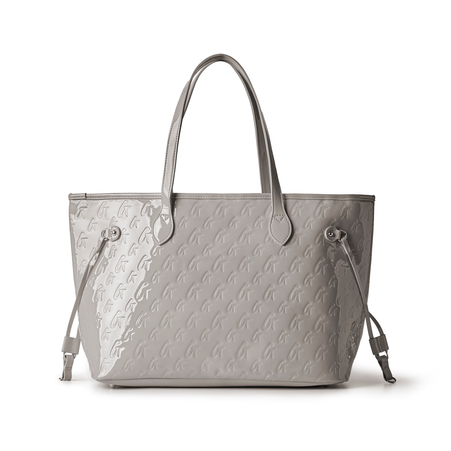 Stylish monogram tote in mirror gray, featuring embossed logo design and adjustable side straps for versatile use.