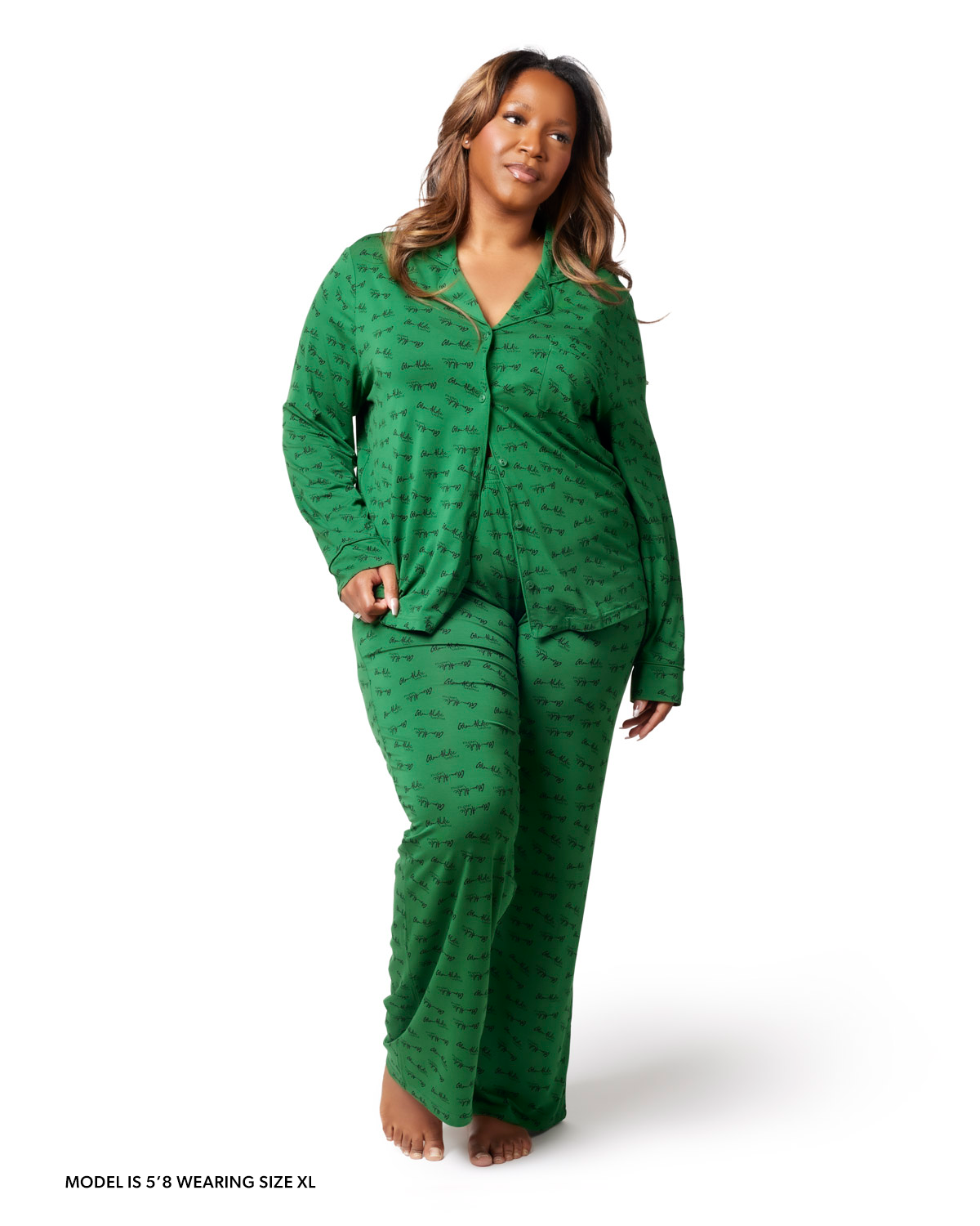 Model wearing green long pajamas with a subtle pattern, showcasing a comfortable and stylish loungewear option.