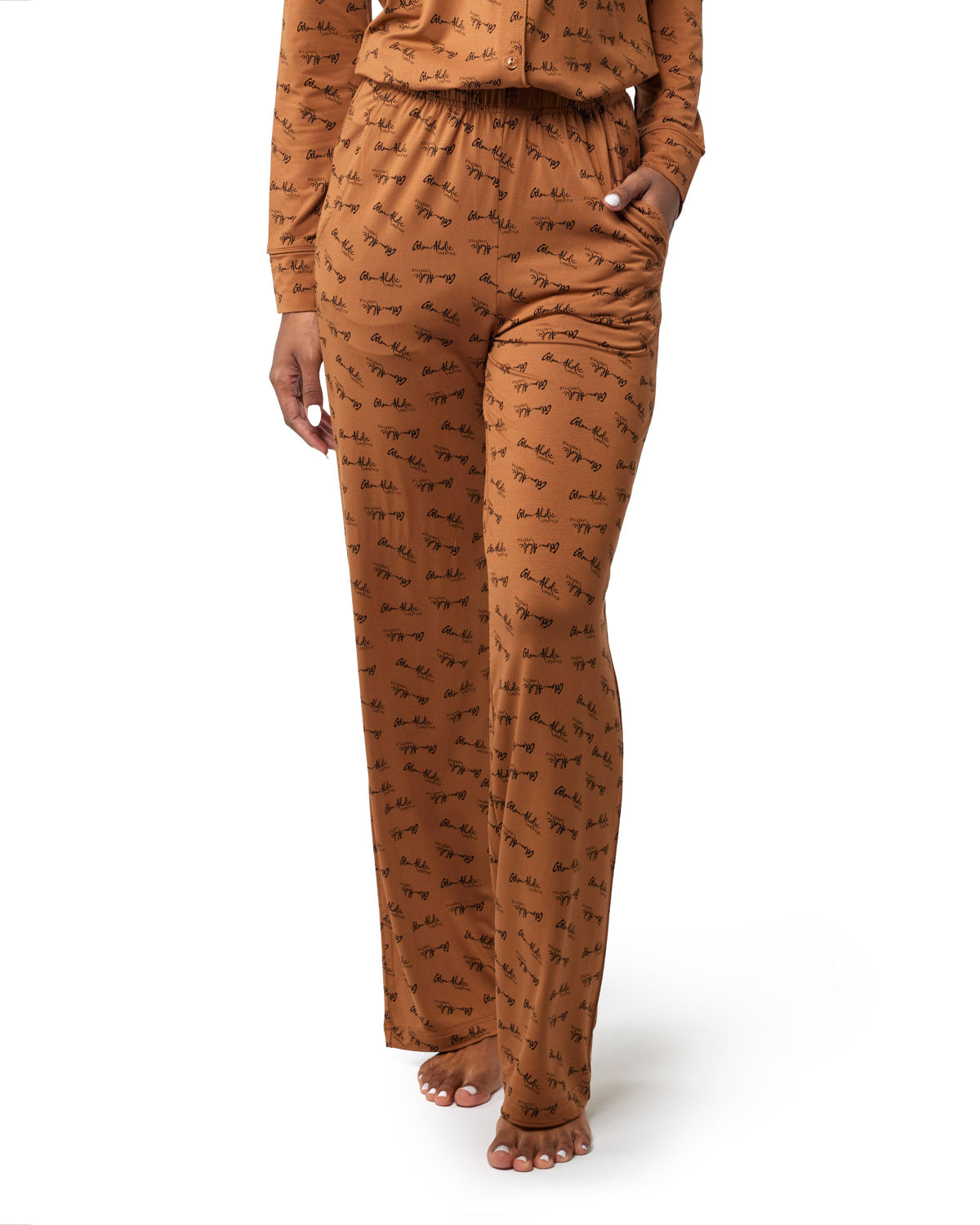 Brown long pajamas featuring a stylish animal print, designed for comfort and a chic loungewear look.