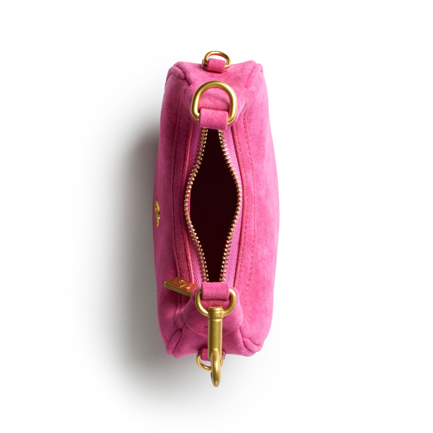 Hot pink nano suede hobo bag with a gold zipper and hardware, showcasing a stylish and chic interior.