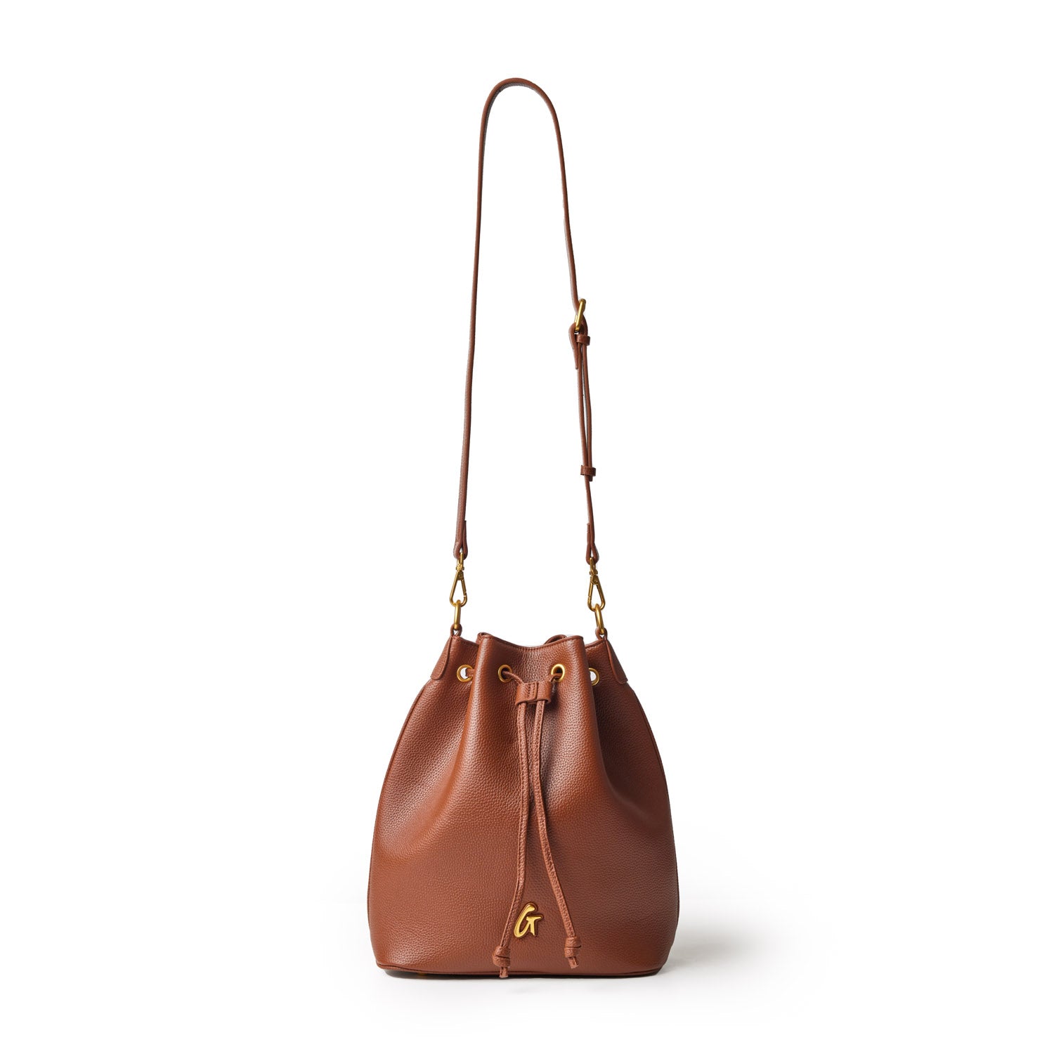 Brown pebble-textured bucket bag with a drawstring closure, gold hardware, and an adjustable shoulder strap.