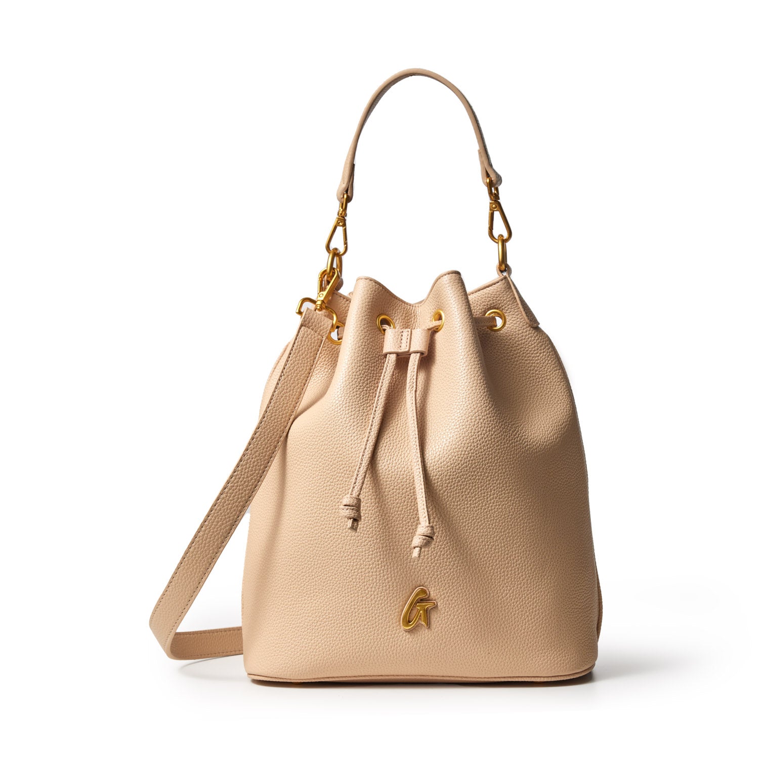 Large nude pebble bucket bag with gold hardware, adjustable strap, and drawstring closure.