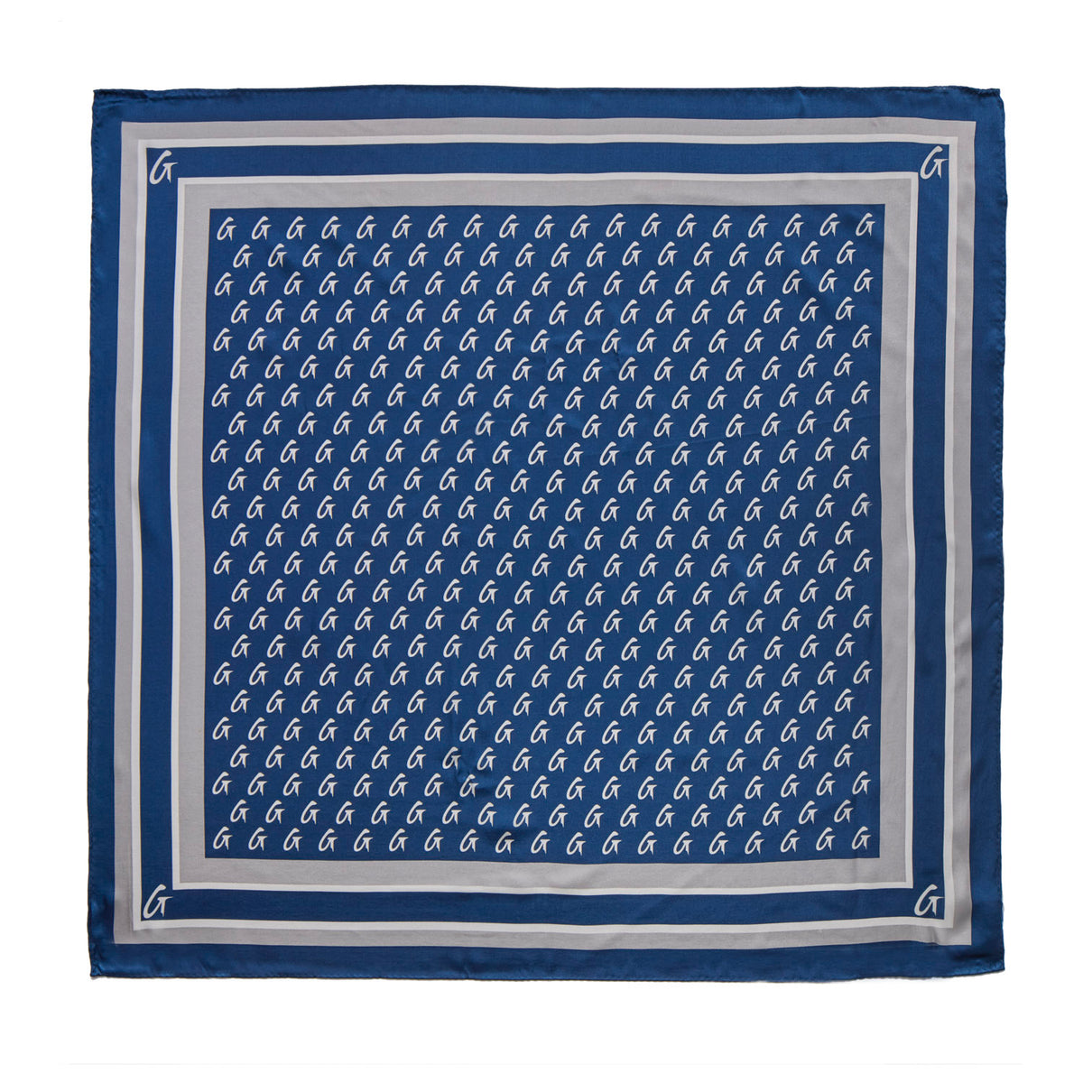 Navy silk scarf featuring a monogram pattern, bordered with a contrasting light trim for a chic, stylish look.