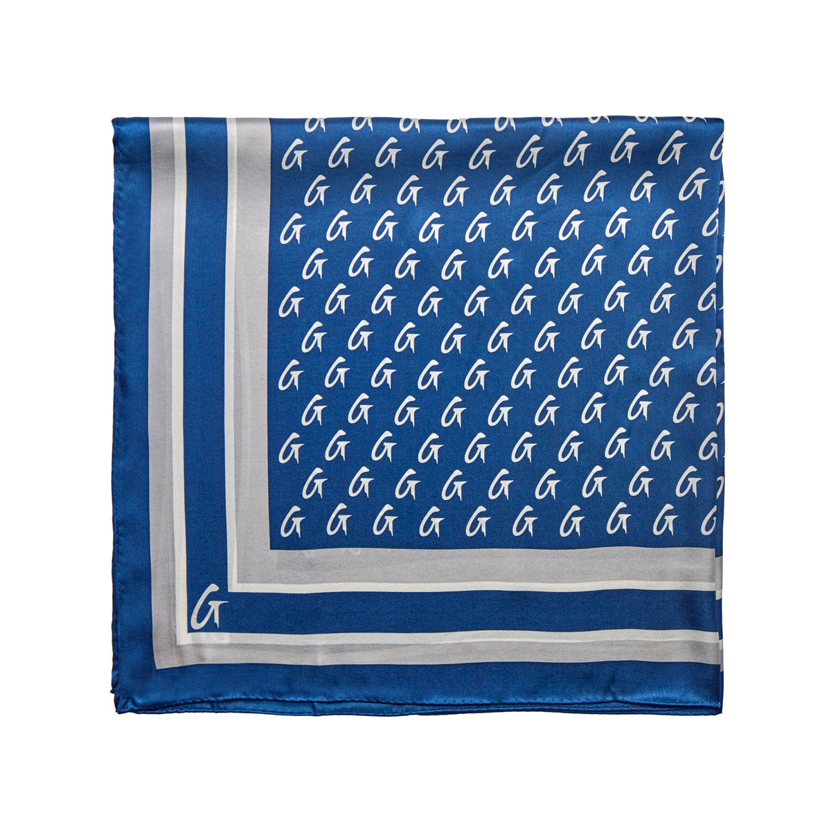 Navy silk scarf featuring a monogram pattern and elegant border, perfect for adding a touch of luxury to any outfit.
